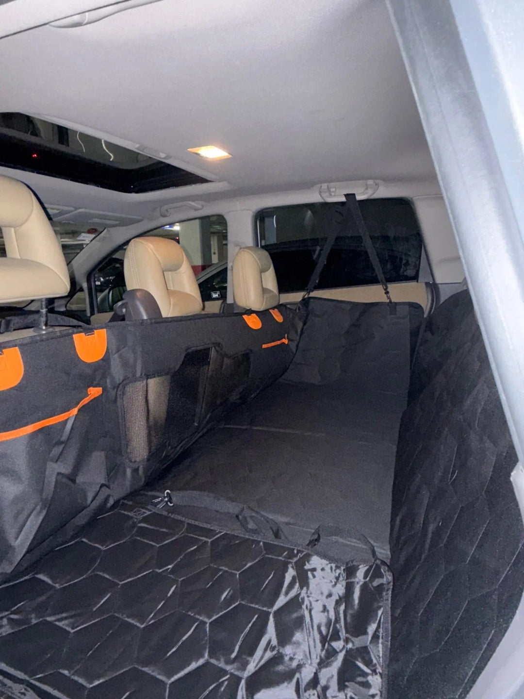 Silverhammock hard-bottom seat cover fitten in a car with beige seats. Featuring great car comfort for dogs on long road trips