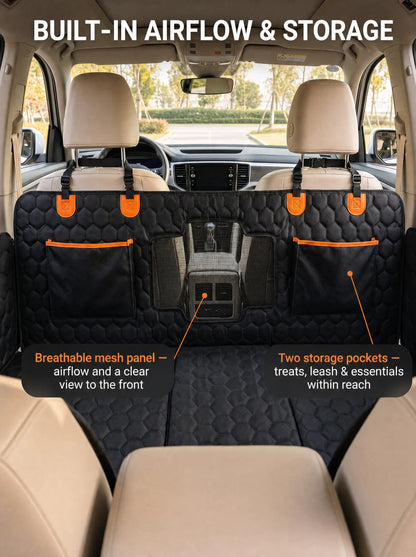 SilverHammock dog seat cover back panel with breathable mesh window and two orange-trimmed storage pockets, seen from the rear seat of an SUV